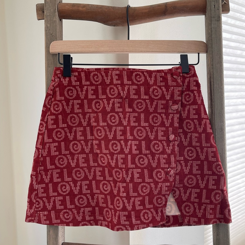 Corduroy “LOVE” mini skirt (Urban Outfitters)